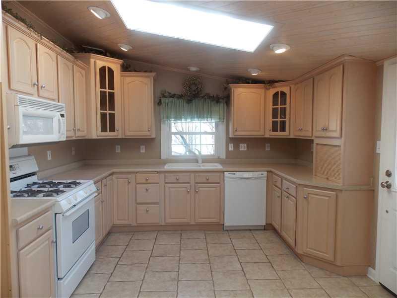 242 Kangaroo Hill Road Lowber, PA 15660 - Photo 5 of 21 Kitchen. As if the ample cabinetry and counter space is not enough...to skylights and recessed lighting enhace this room as well!