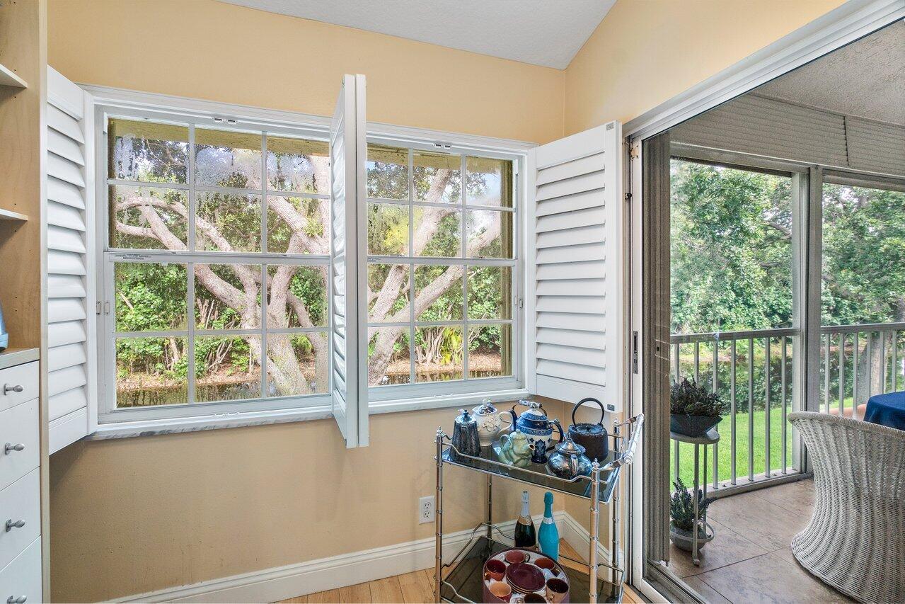 17266 Boca Club Boulevard, Unit 1603 Boca Raton, FL 33487 - Photo 1 of 42 a front view of a house with garden