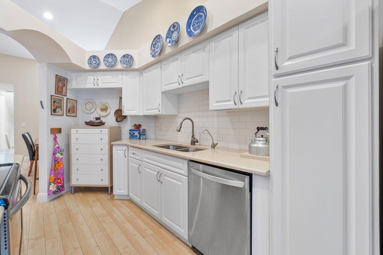 17266 Boca Club Boulevard, Unit 1603 Boca Raton, FL 33487 - Photo 14 of 42 a kitchen with stainless steel appliances granite countertop a sink and cabinets