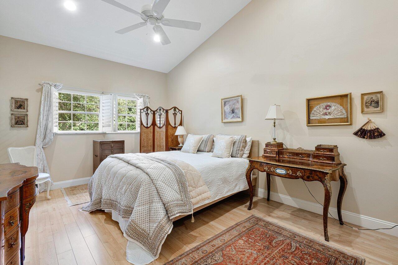 17266 Boca Club Boulevard, Unit 1603 Boca Raton, FL 33487 - Photo 19 of 42 a bedroom with a bed and a desk