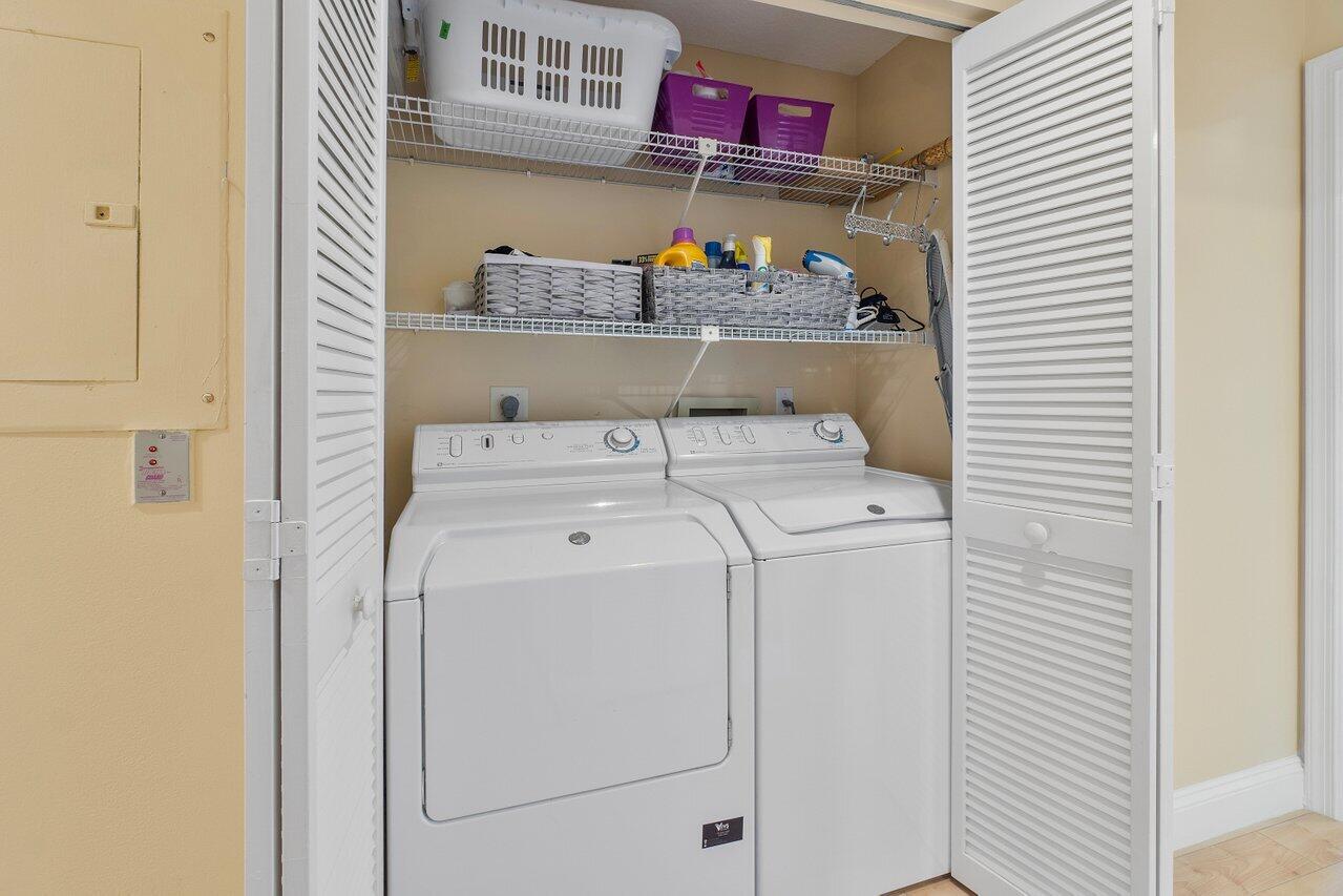 17266 Boca Club Boulevard, Unit 1603 Boca Raton, FL 33487 - Photo 26 of 42 a utility room with dryer and washer