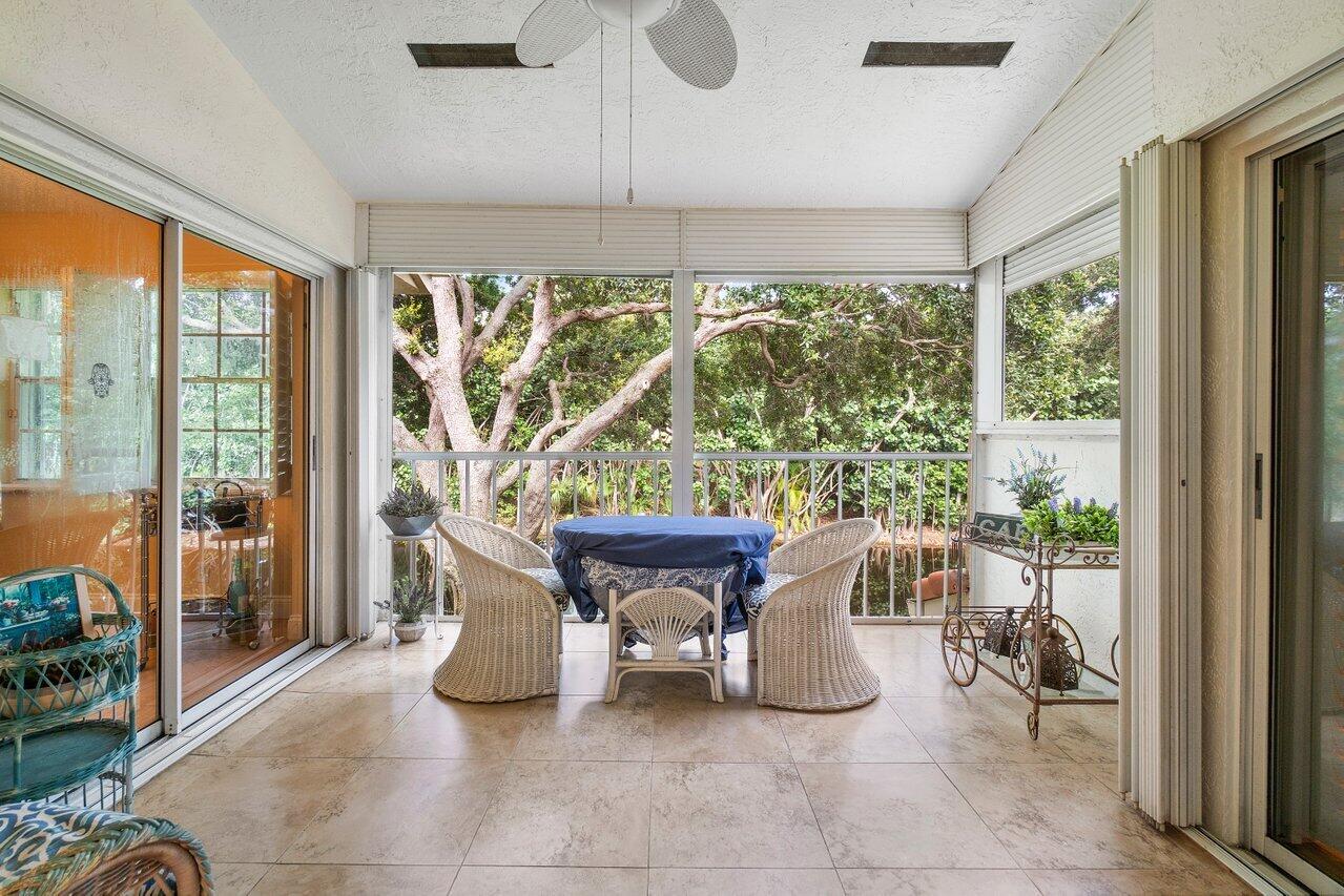 17266 Boca Club Boulevard, Unit 1603 Boca Raton, FL 33487 - Photo 30 of 42 a dining room with furniture and a floor to ceiling window