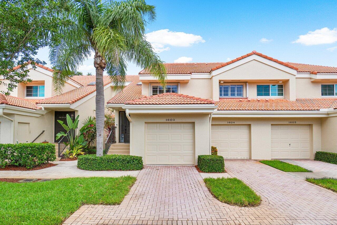 17266 Boca Club Boulevard, Unit 1603 Boca Raton, FL 33487 - Photo 3 of 42 a front view of house with yard and green space