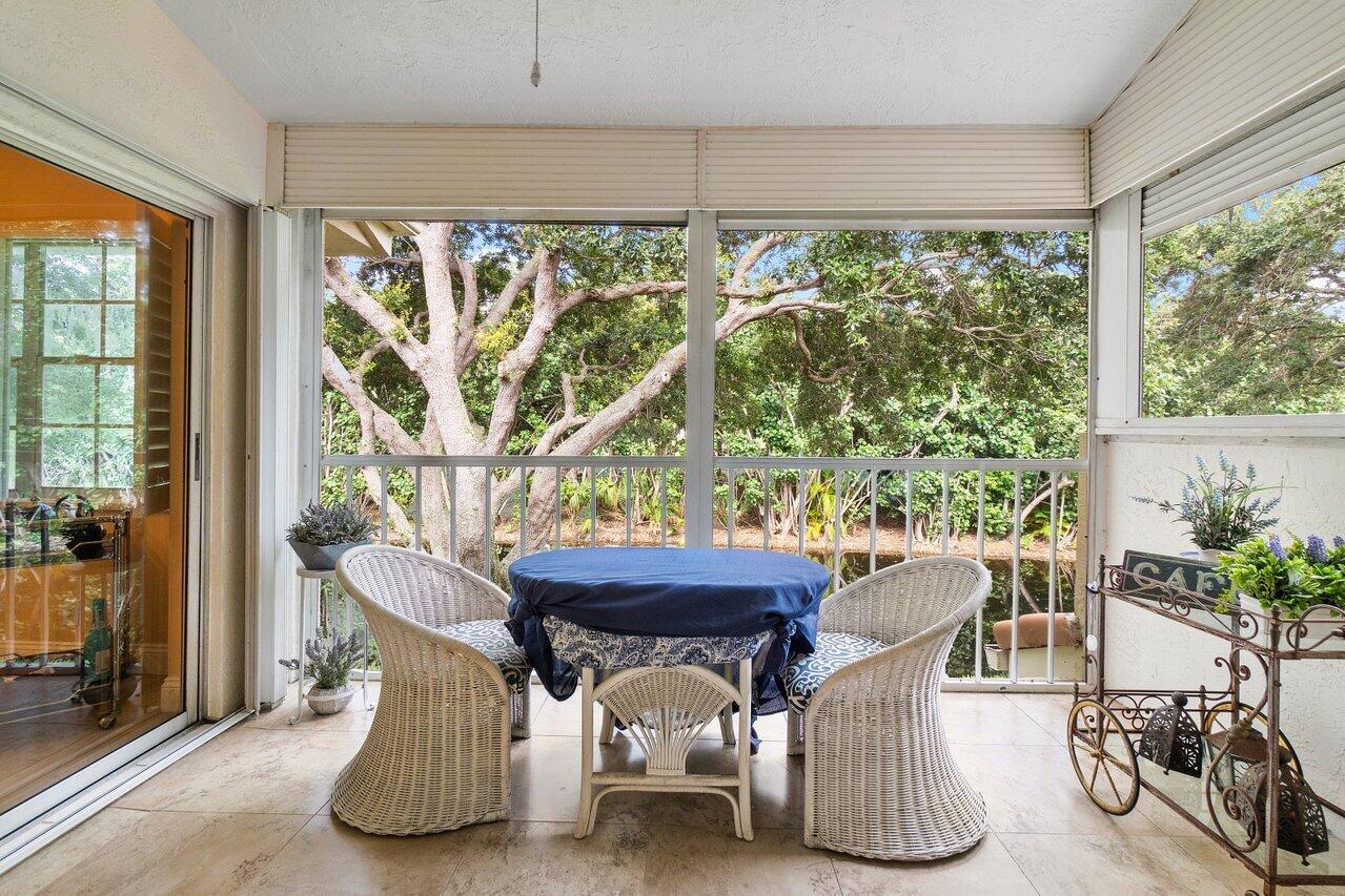17266 Boca Club Boulevard, Unit 1603 Boca Raton, FL 33487 - Photo 31 of 42 a view of a dining room with furniture window and outside view