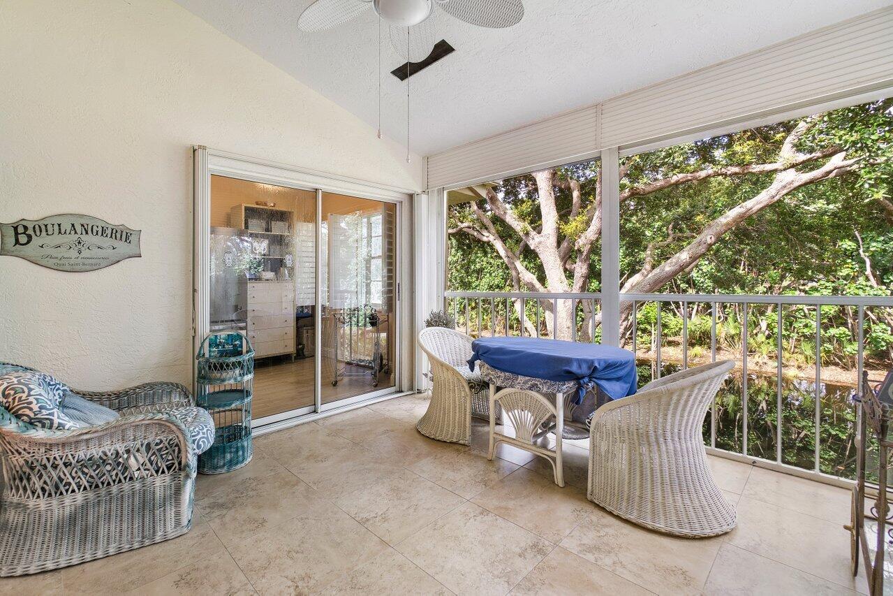 17266 Boca Club Boulevard, Unit 1603 Boca Raton, FL 33487 - Photo 32 of 42 a living room with furniture and a large window
