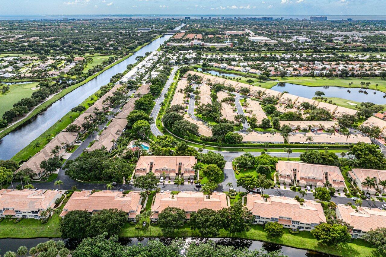 17266 Boca Club Boulevard, Unit 1603 Boca Raton, FL 33487 - Photo 41 of 42 an aerial view of a city with lots of residential buildings ocean and mountain view in back