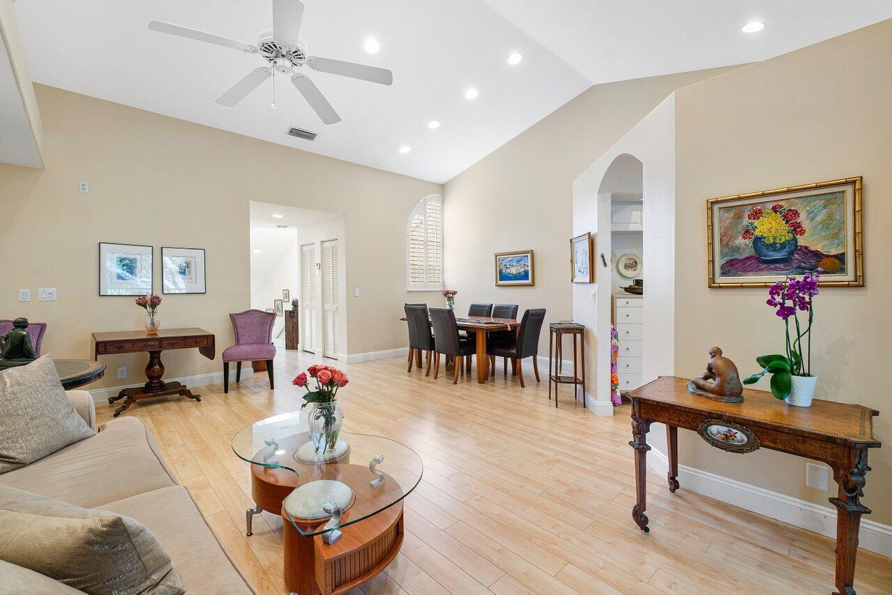 17266 Boca Club Boulevard, Unit 1603 Boca Raton, FL 33487 - Photo 7 of 42 a living room with furniture and wooden floor
