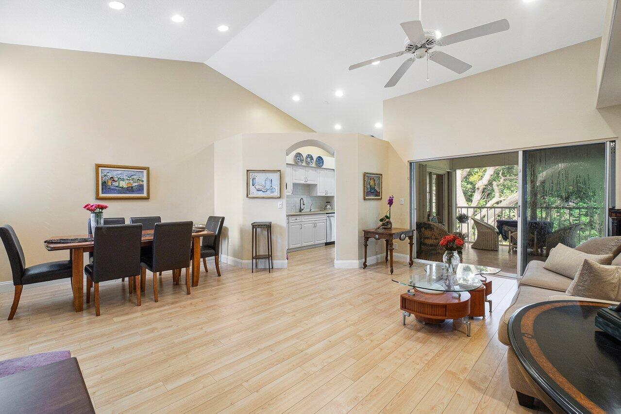 17266 Boca Club Boulevard, Unit 1603 Boca Raton, FL 33487 - Photo 8 of 42 a living room with furniture and wooden floor
