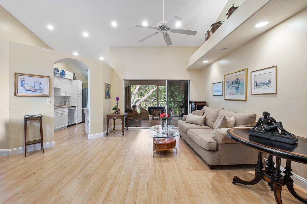17266 Boca Club Boulevard, Unit 1603 Boca Raton, FL 33487 - Photo 9 of 42 a living room with furniture and a wooden floor