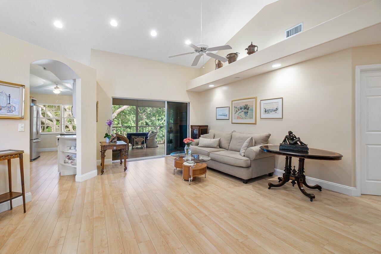 17266 Boca Club Boulevard, Unit 1603 Boca Raton, FL 33487 - Photo 10 of 42 a living room with furniture and a wooden floor