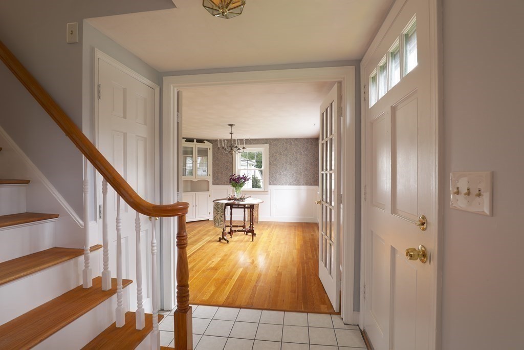 36 Parting Rock Road Duxbury, MA 02332 - Photo 12 of 29 a view of an entryway with wooden floor and a livingroom view