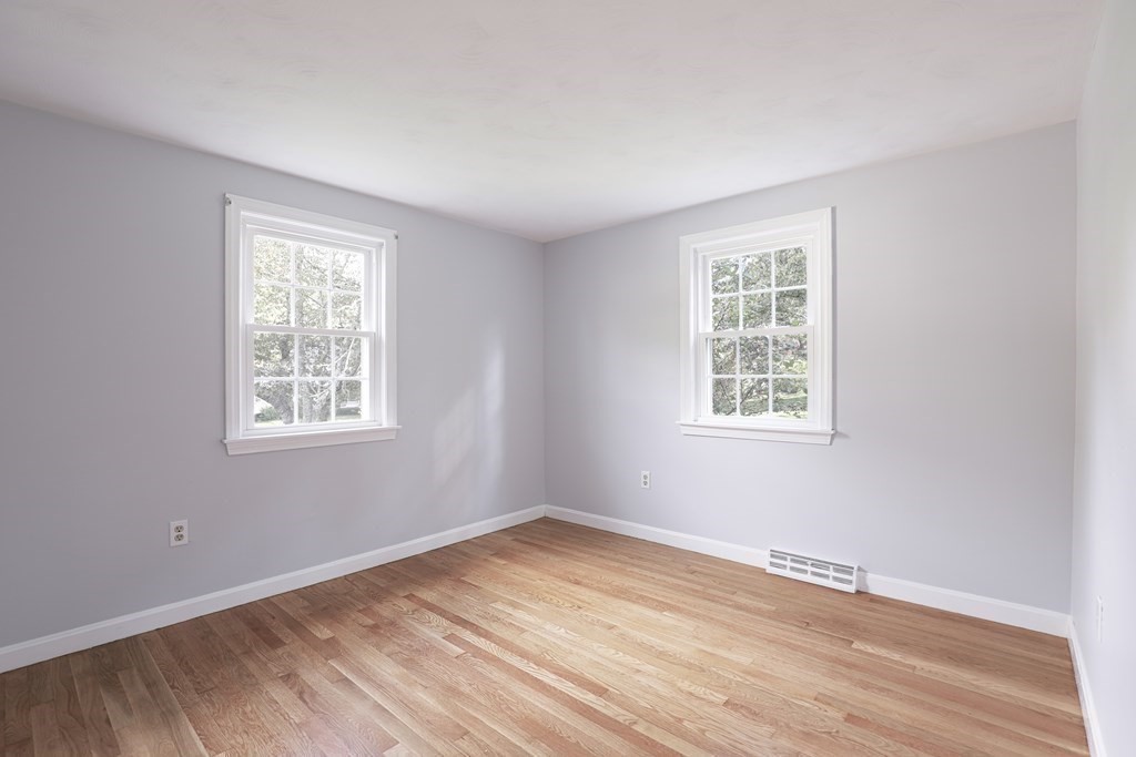 36 Parting Rock Road Duxbury, MA 02332 - Photo 22 of 29 an empty room with wooden floor and windows