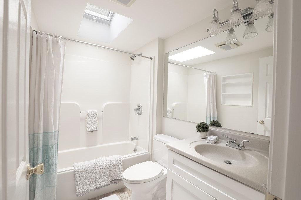 36 Parting Rock Road Duxbury, MA 02332 - Photo 24 of 29 a bathroom with a sink a toilet and shower