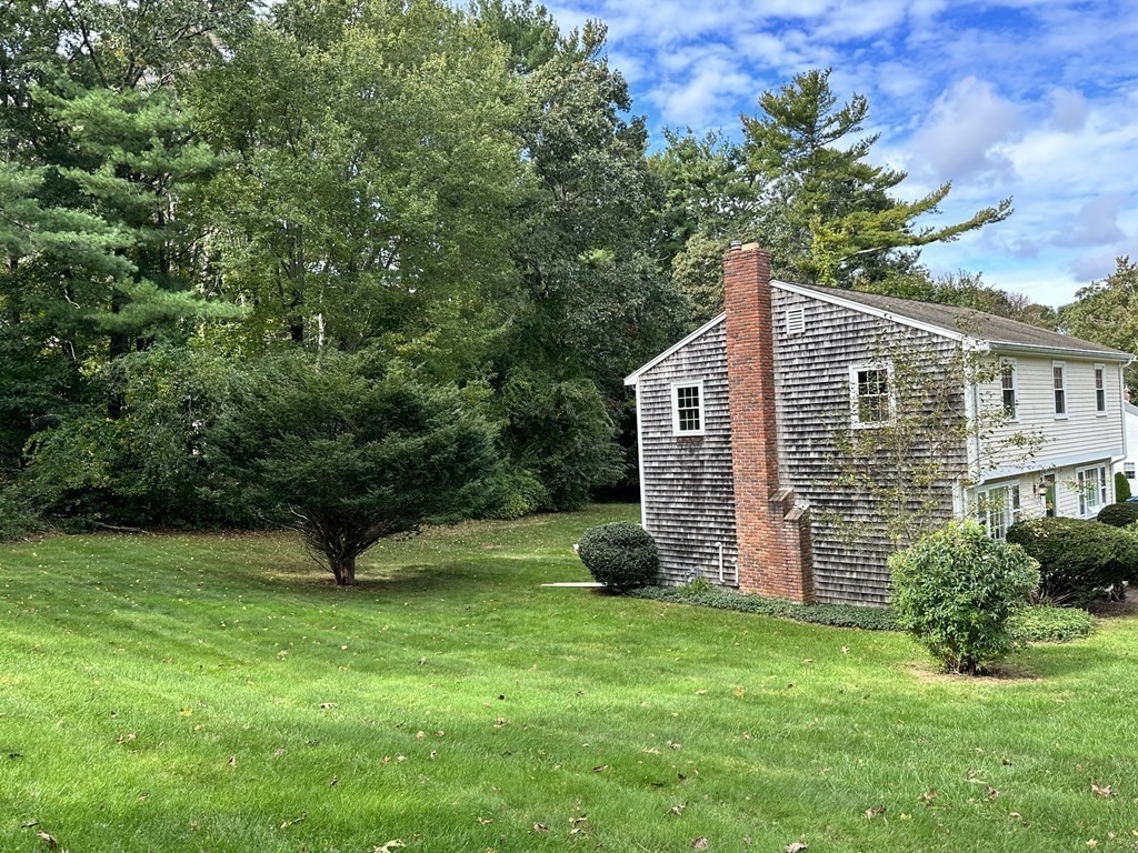 36 Parting Rock Road Duxbury, MA 02332 - Photo 29 of 29 a view of a house with backyard and garden
