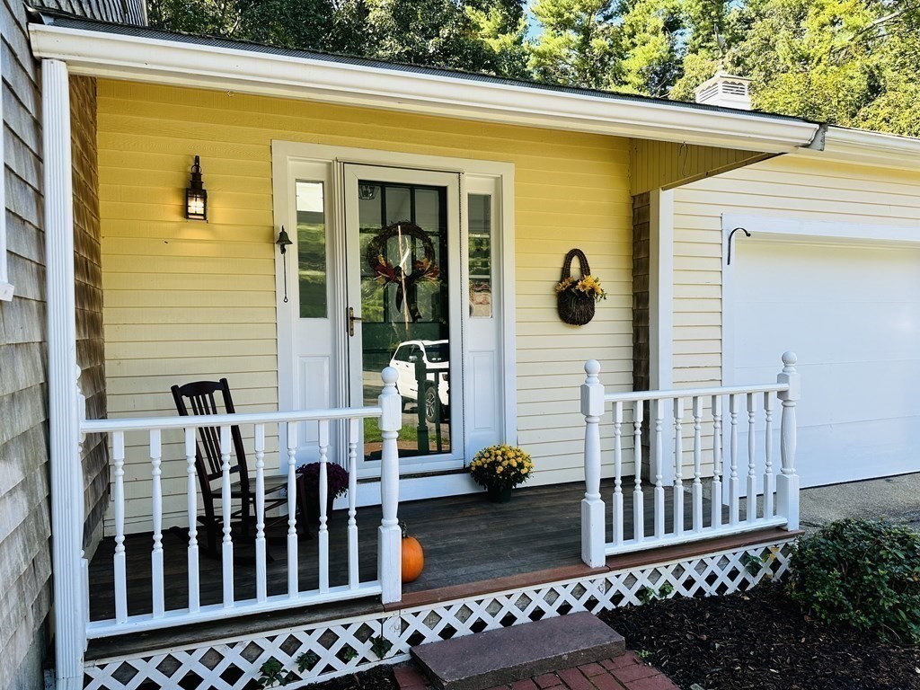 36 Parting Rock Road Duxbury, MA 02332 - Photo 5 of 29 a view of a wooden house with a wooden fence