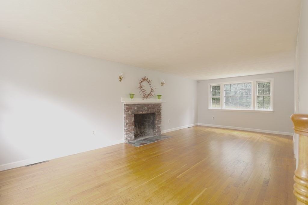 36 Parting Rock Road Duxbury, MA 02332 - Photo 8 of 29 a view of an empty room with a window and fireplace