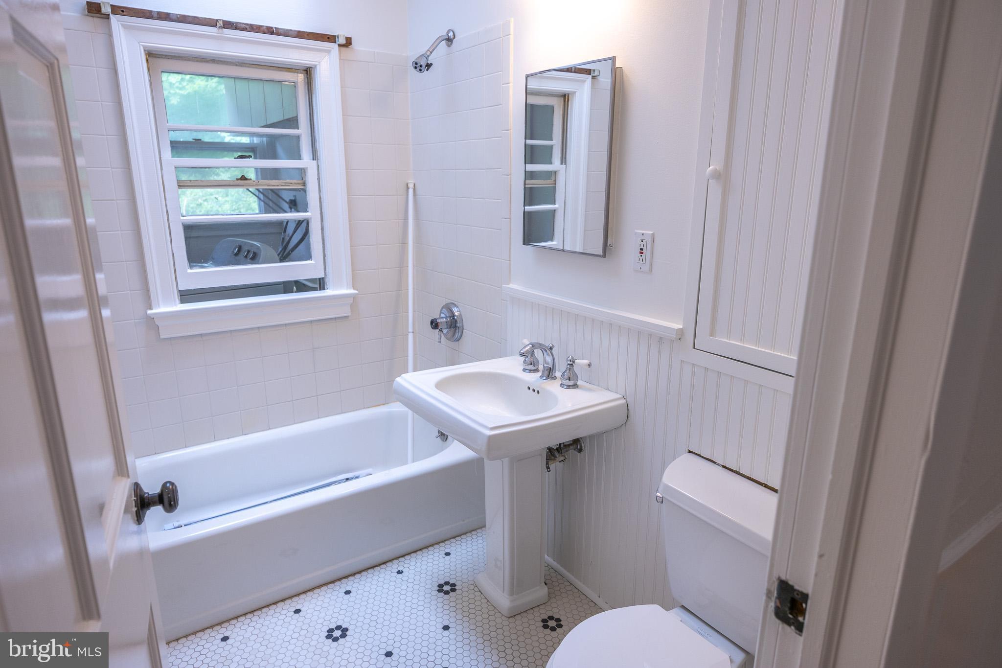 98 Swindler Hollow Road Sperryville, VA 22740 - Photo 17 of 25 a bathroom with a sink a toilet and a bathtub