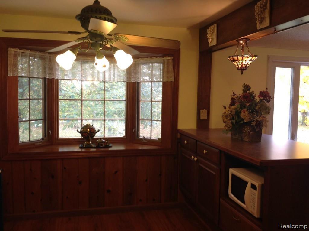 6147 Willis Road North Branch, MI 48461 - Photo 14 of 41 Breakfast Nook with Bar and Tiffany Lamp
