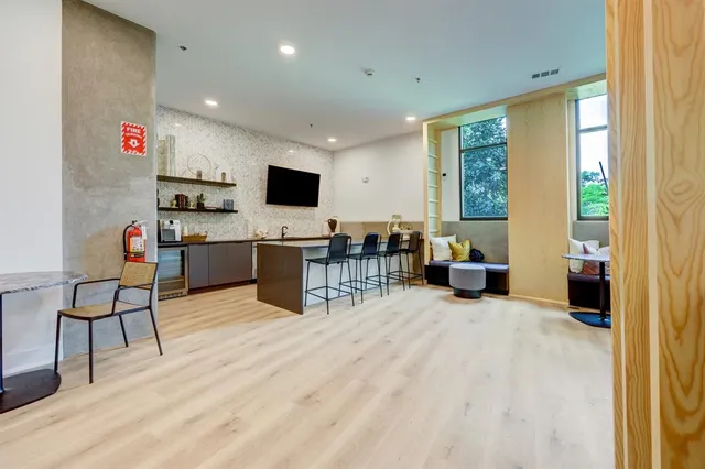 a bathroom with a double vanity sink toilet and shower