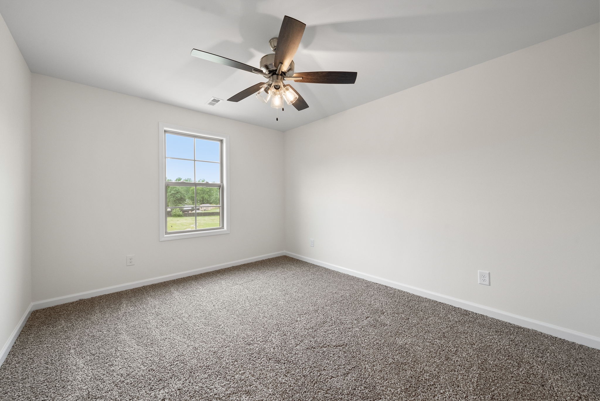 1912 Evans Road Clarksville, TN 37042 - Photo 15 of 32 an empty room with windows and fan