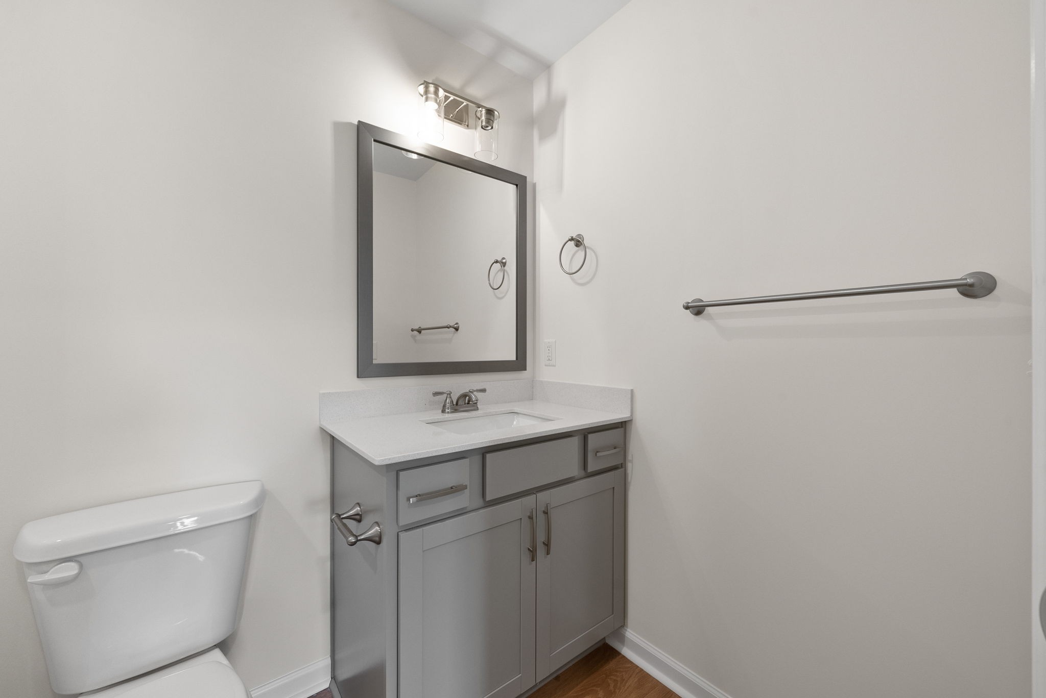 1912 Evans Road Clarksville, TN 37042 - Photo 18 of 32 a bathroom with a sink a toilet and mirror