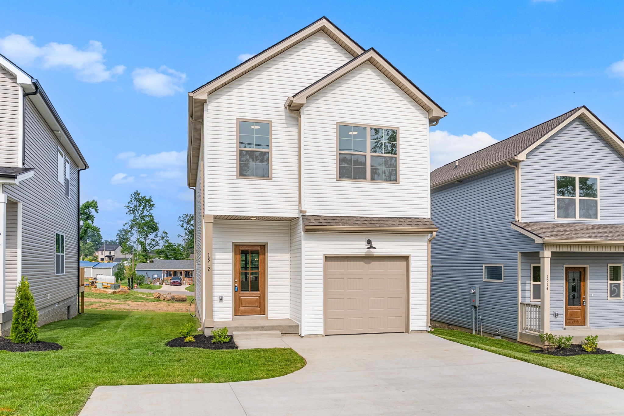 1912 Evans Road Clarksville, TN 37042 - Photo 27 of 32 a front view of a house with a yard and garage