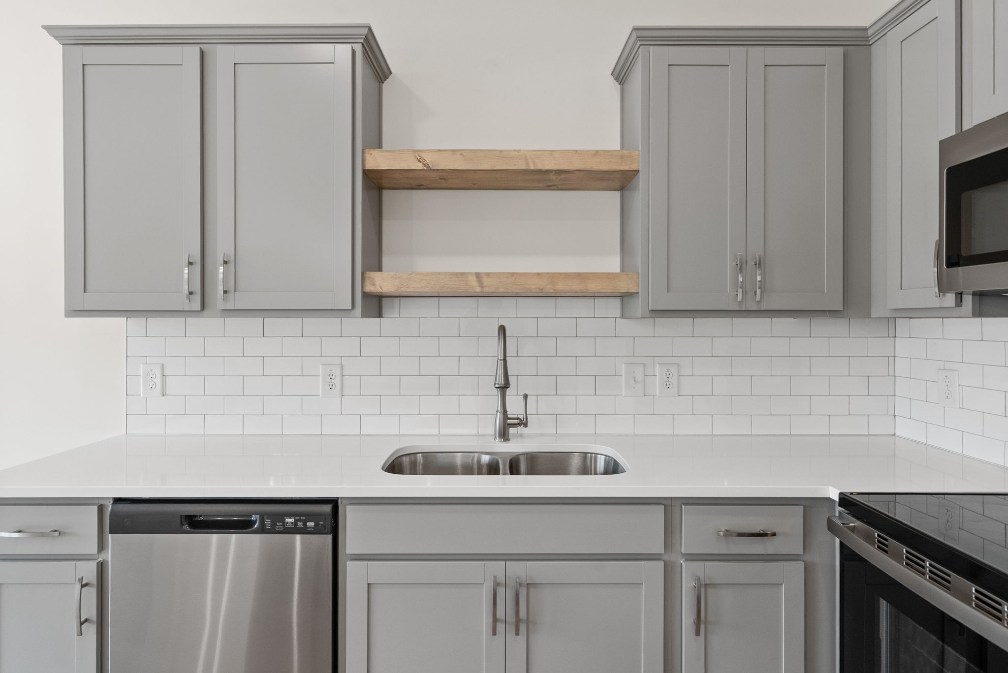 1912 Evans Road Clarksville, TN 37042 - Photo 3 of 32 a kitchen with white cabinets a sink and dishwasher
