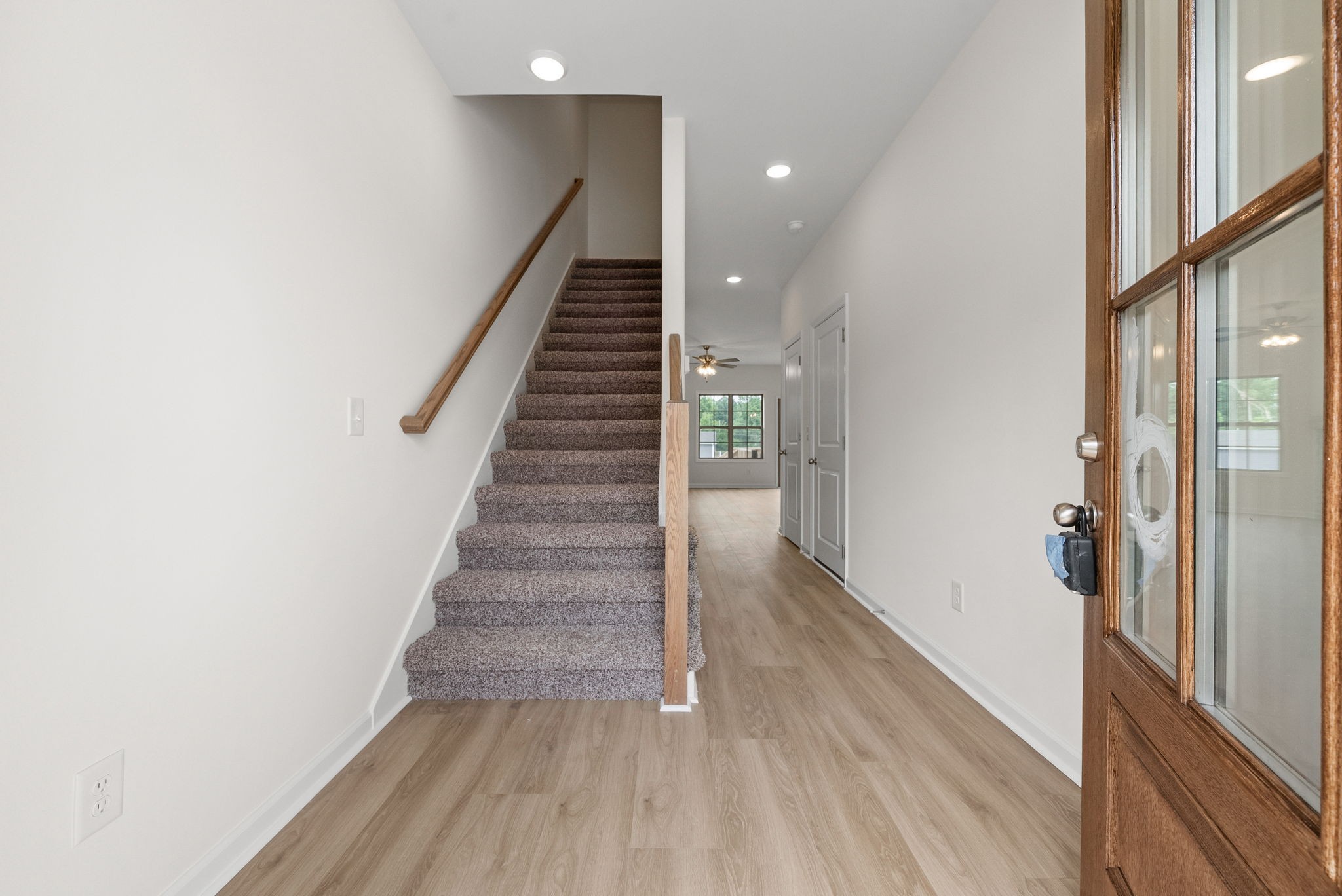 1912 Evans Road Clarksville, TN 37042 - Photo 4 of 32 a view of a hallway with wooden floor and staircase