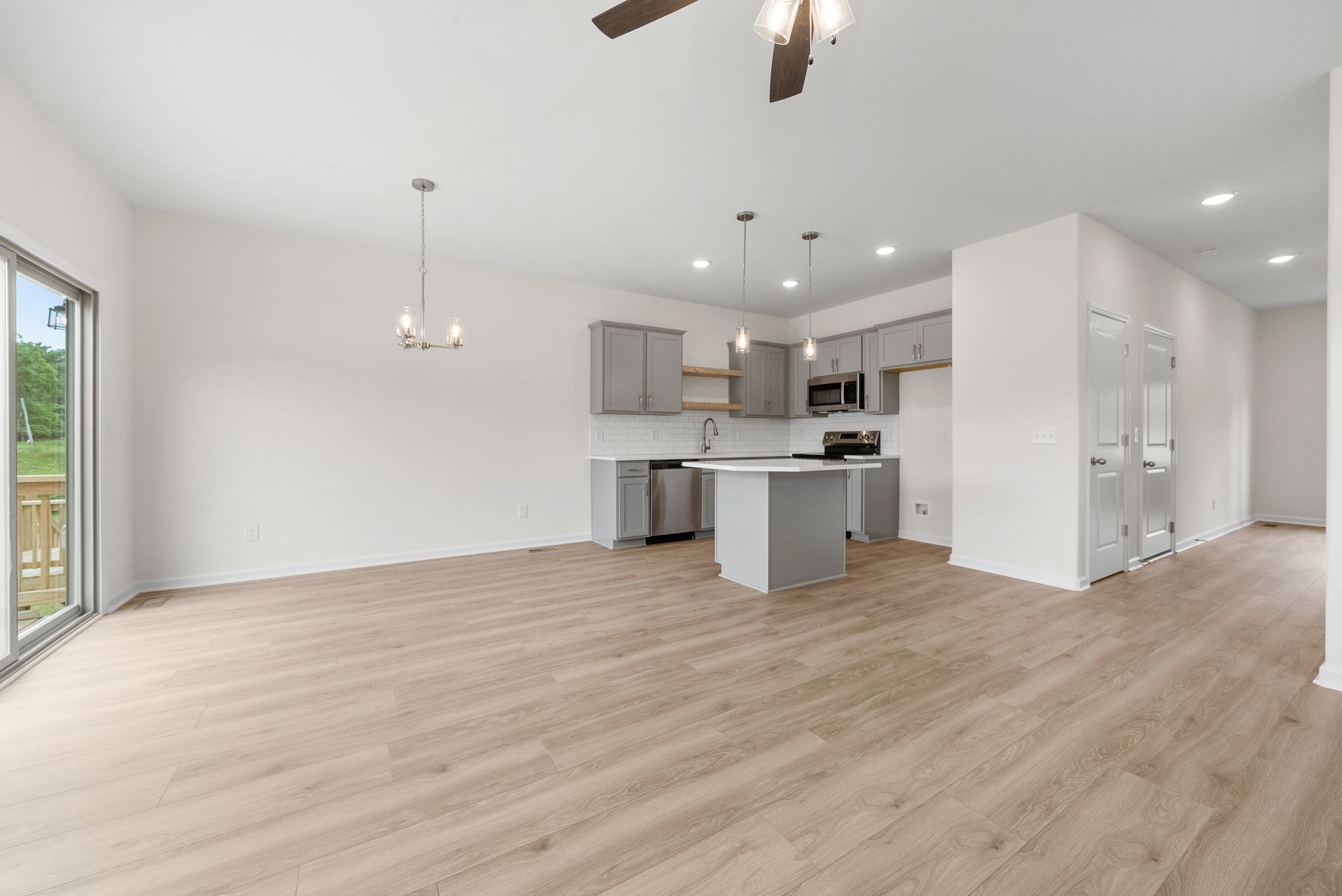 1912 Evans Road Clarksville, TN 37042 - Photo 9 of 32 a view of kitchen with kitchen island stainless steel appliances sink cabinets and wooden floor