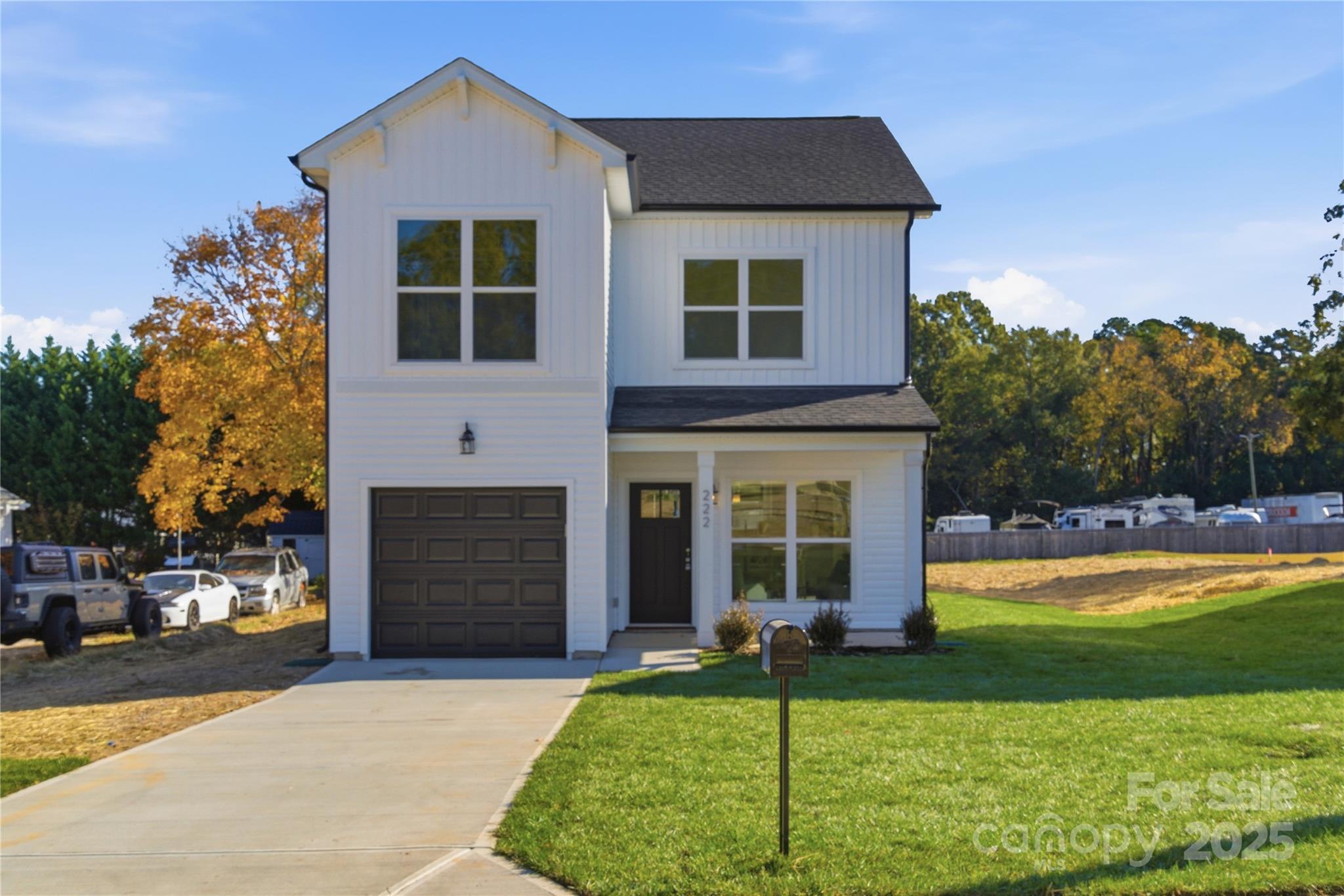222 1st Street South Fort Mill, SC 29708 - Photo 1 of 23 a front view of a house with a yard and garage