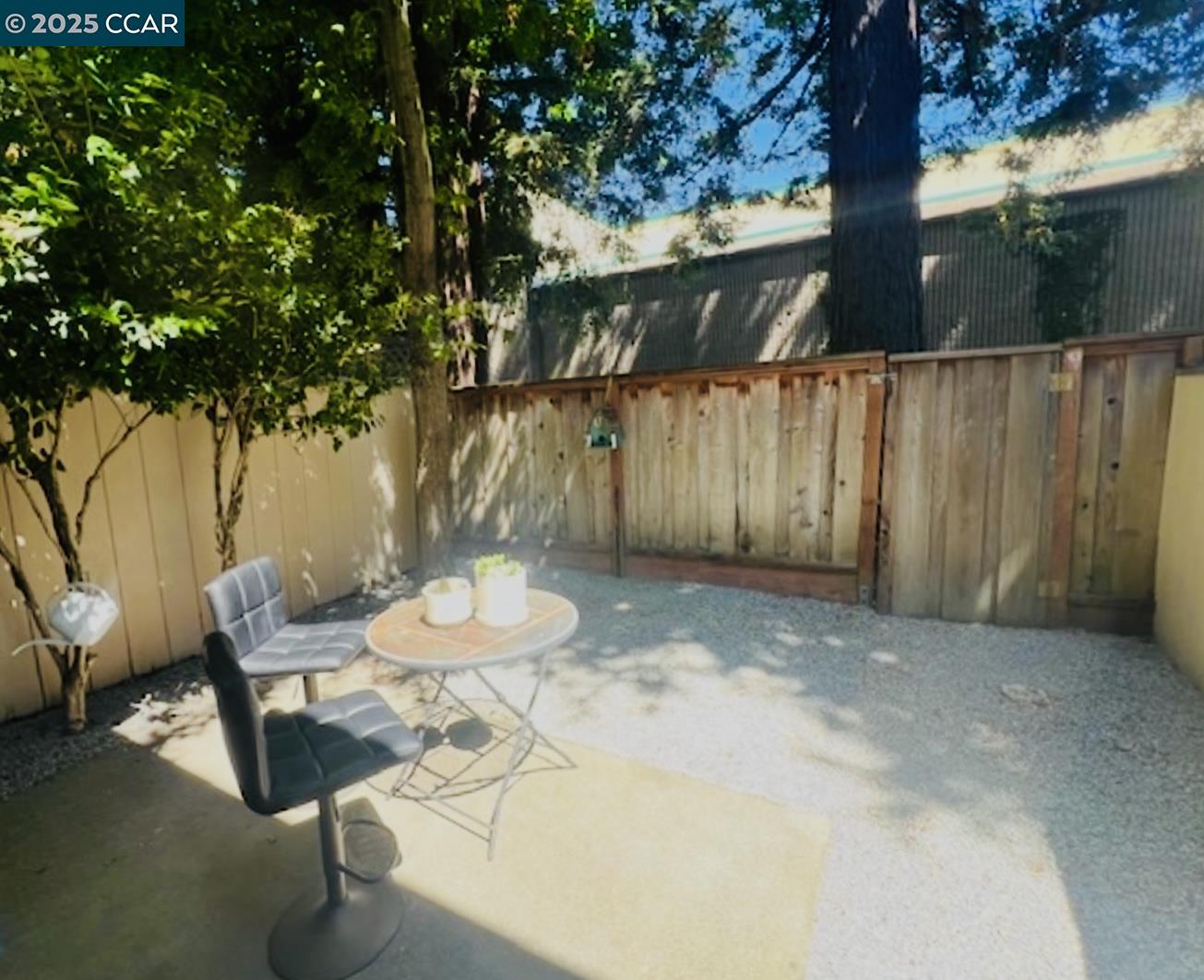 2129 Ascot Drive, Unit 15 Moraga, CA 94556 - Photo 3 of 9 a backyard of a house with table and chairs