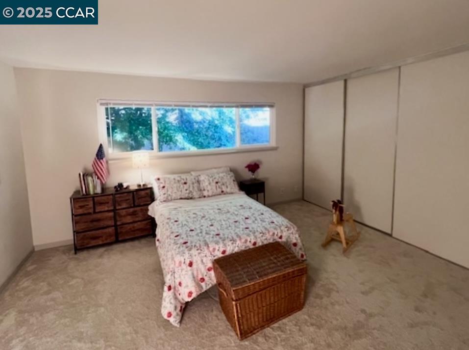 2129 Ascot Drive, Unit 15 Moraga, CA 94556 - Photo 6 of 9 a bedroom with a bed and a window