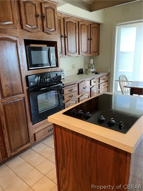 1266 Queenstown Road Lancaster, VA 22503 - Photo 30 of 46 a kitchen with stainless steel appliances a stove a microwave a sink and a refrigerator