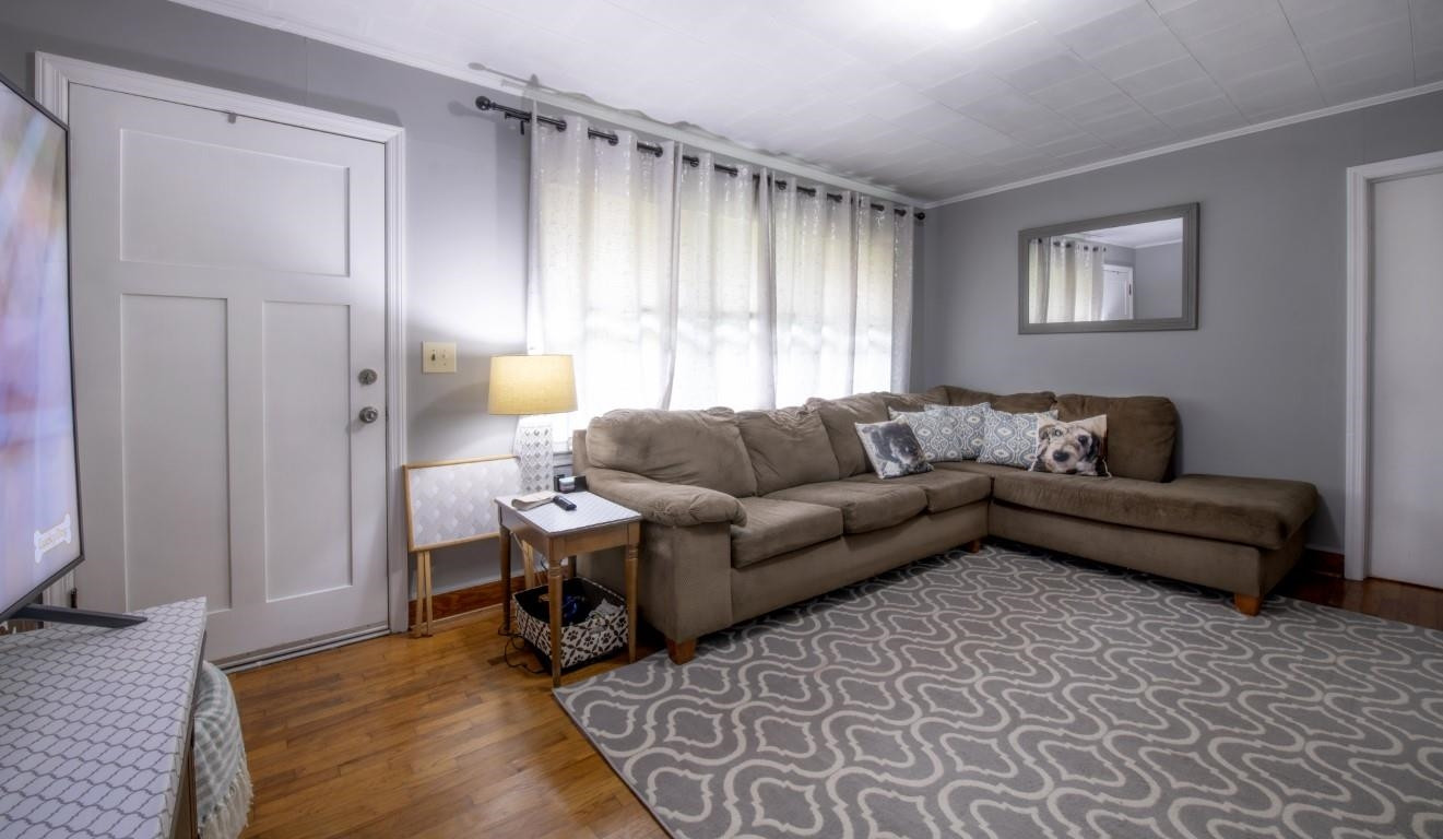 3795 Seven Paths Road Louisburg, NC 27549 - Photo 14 of 21 a living room with furniture and a rug