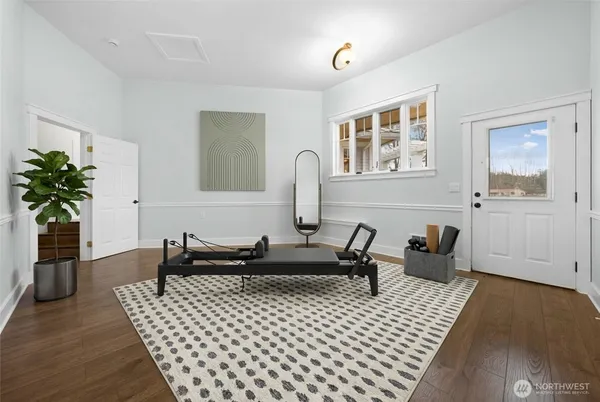 a view of a house with backyard and sitting area