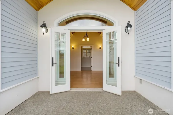 a view of a hallway with wooden shelves