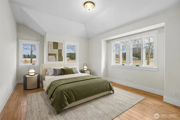 a view of a dining room with furniture and a potted plant