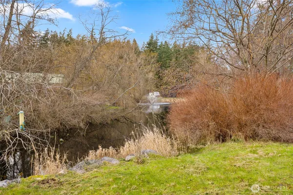 a bathroom with a toilet a sink and a window