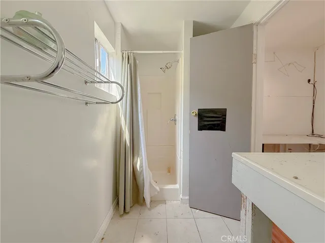 a very nice looking room with wooden floor and furniture