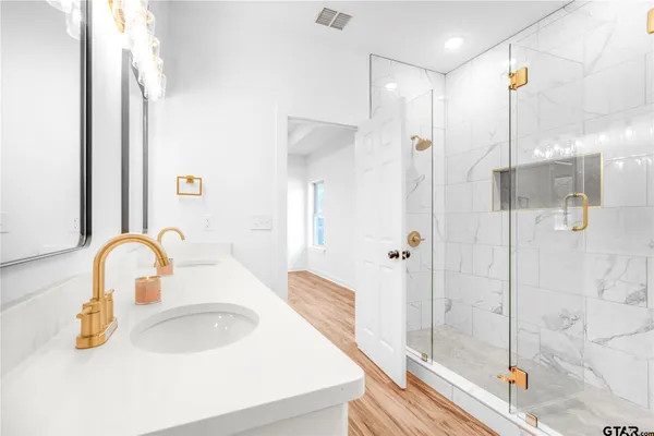 a bathroom with a sink and mirror