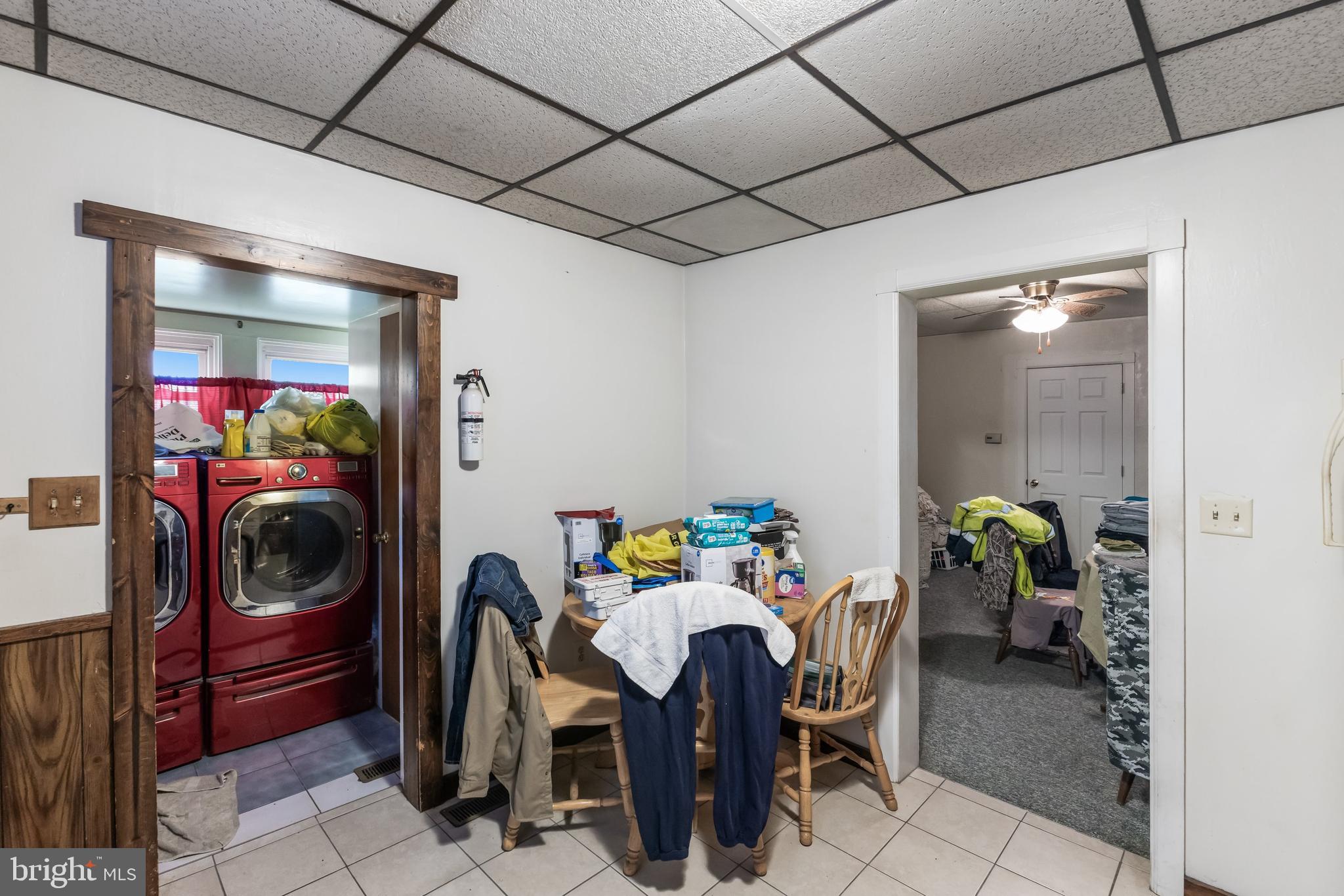 237 South 3rd Street Millville, NJ 08332 - Photo 11 of 23 a dining room with furniture and a chandelier