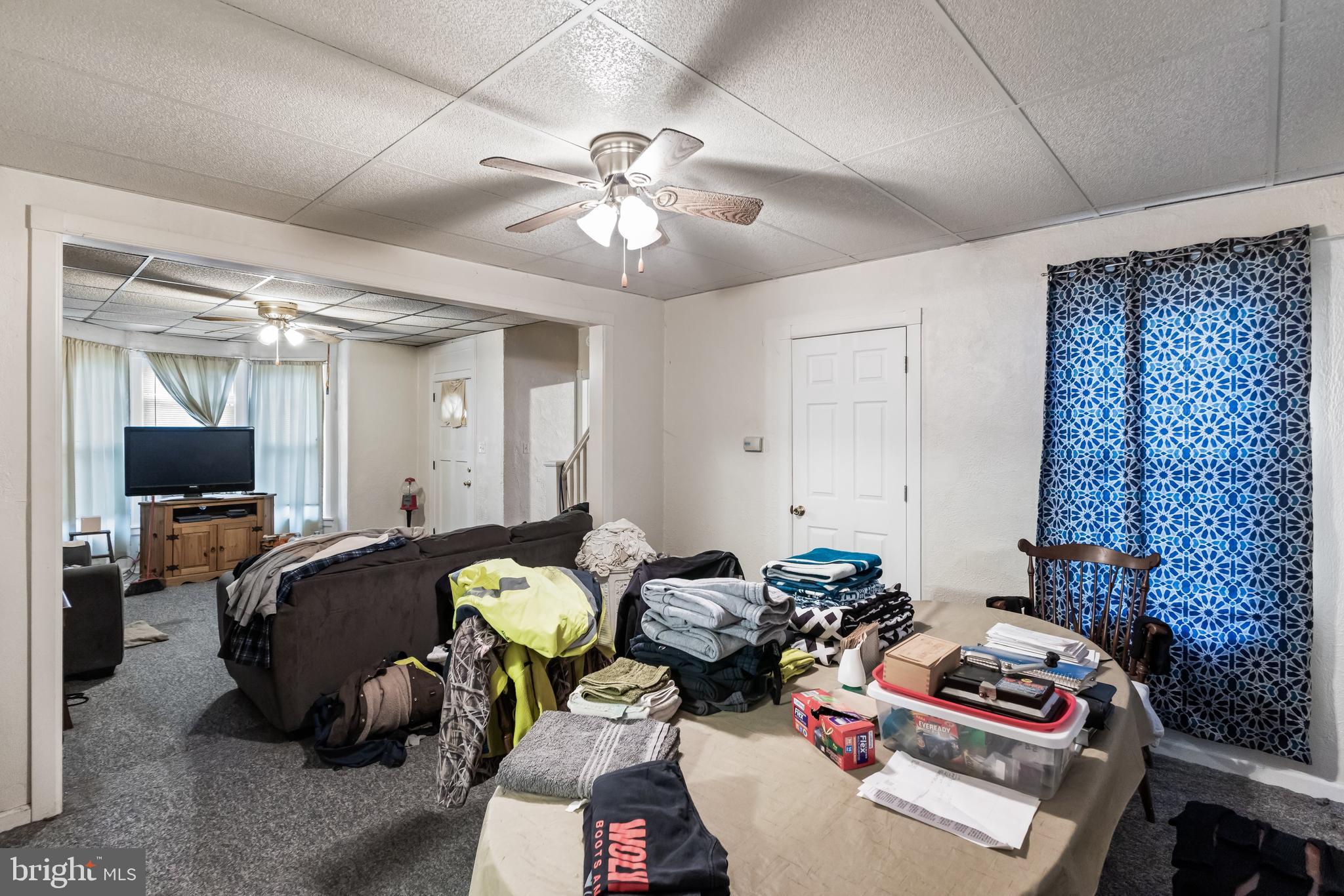 237 South 3rd Street Millville, NJ 08332 - Photo 17 of 23 a bedroom with furniture and a chandelier
