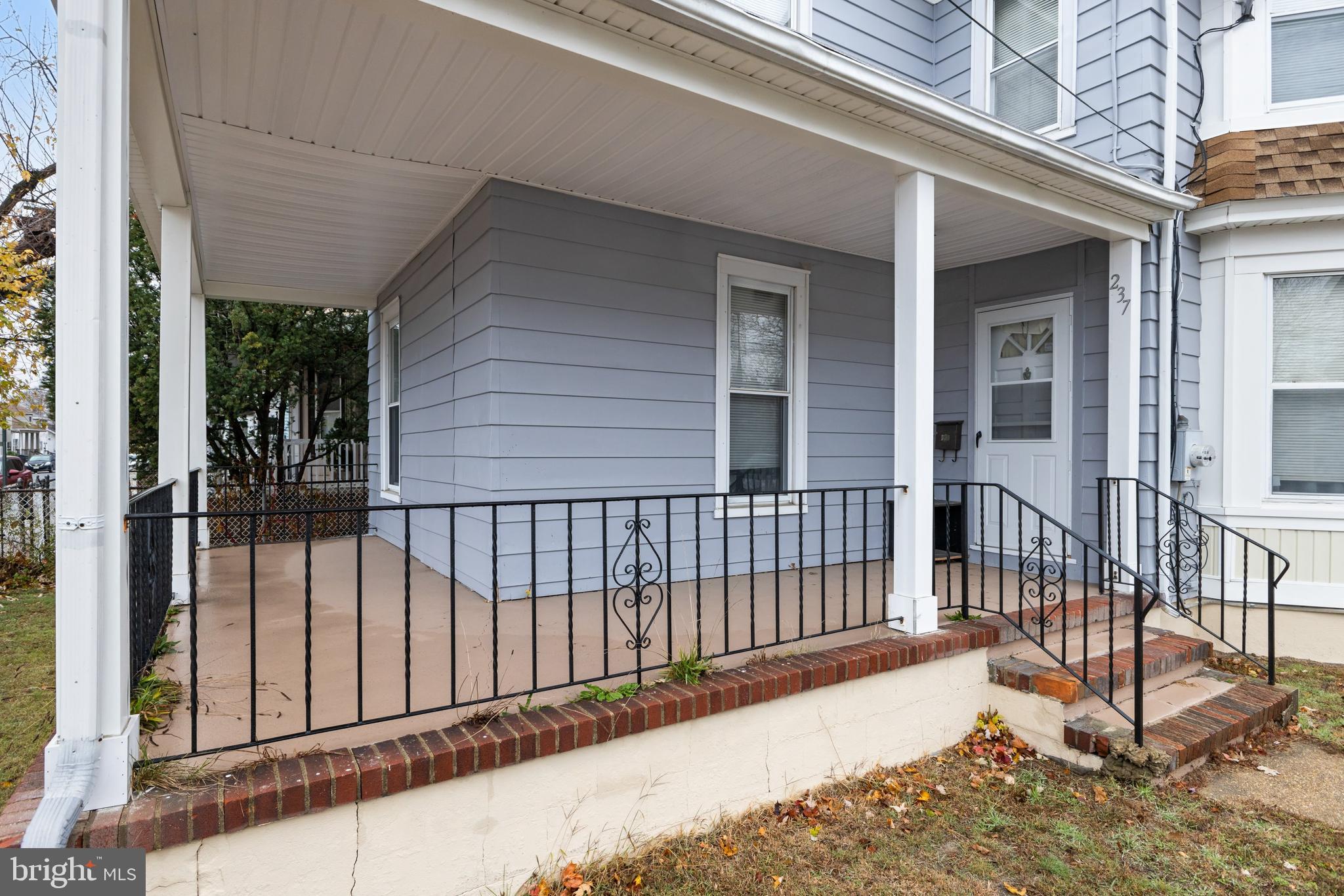 237 South 3rd Street Millville, NJ 08332 - Photo 3 of 23 a view of a house with a wooden fence
