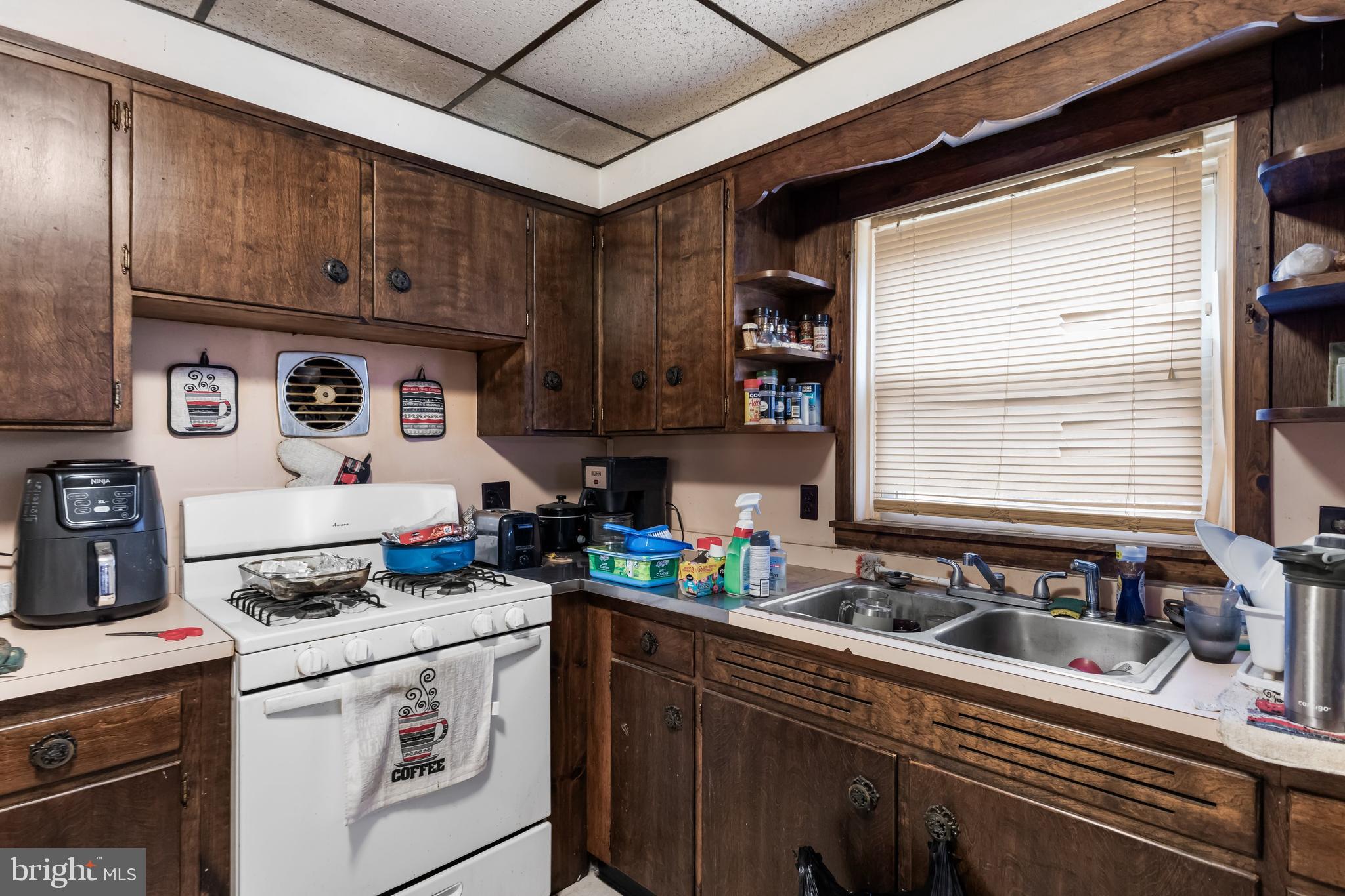 237 South 3rd Street Millville, NJ 08332 - Photo 10 of 23 a kitchen with a stove and a white cabinets