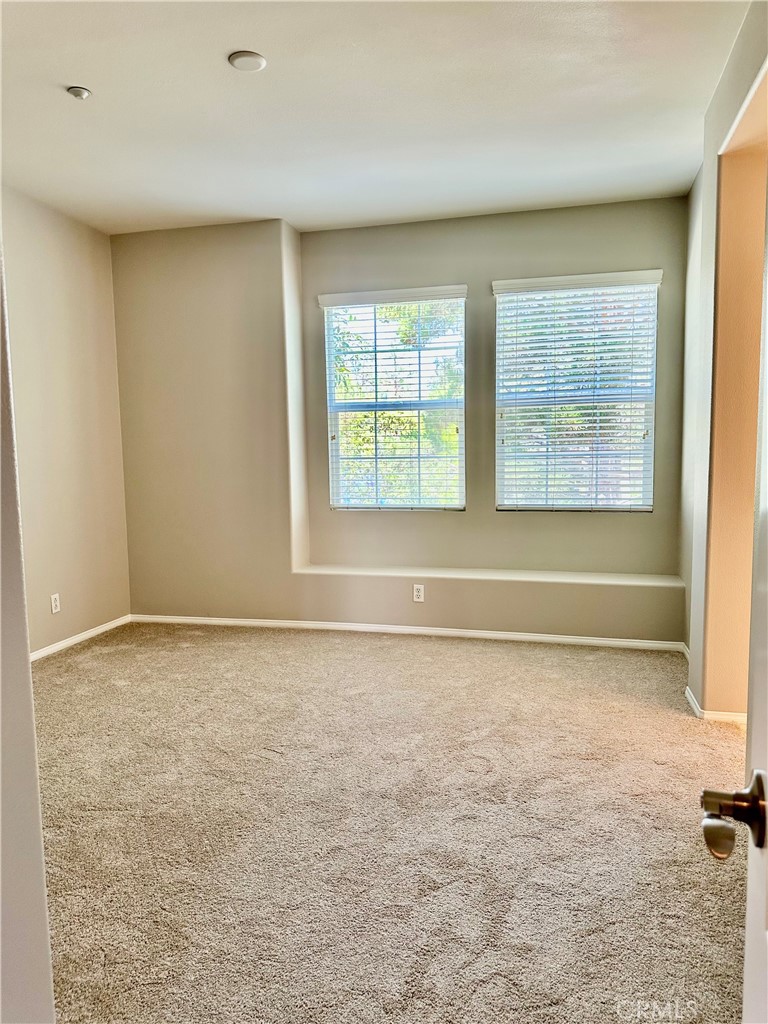 21 Durlston Way Ladera Ranch, CA 92694 - Photo 19 of 47 a view of an empty room with a window