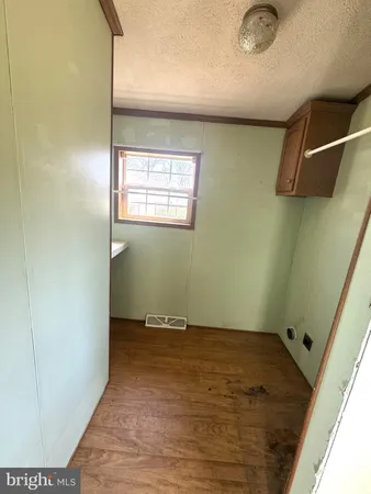 an empty room with a wooden floor