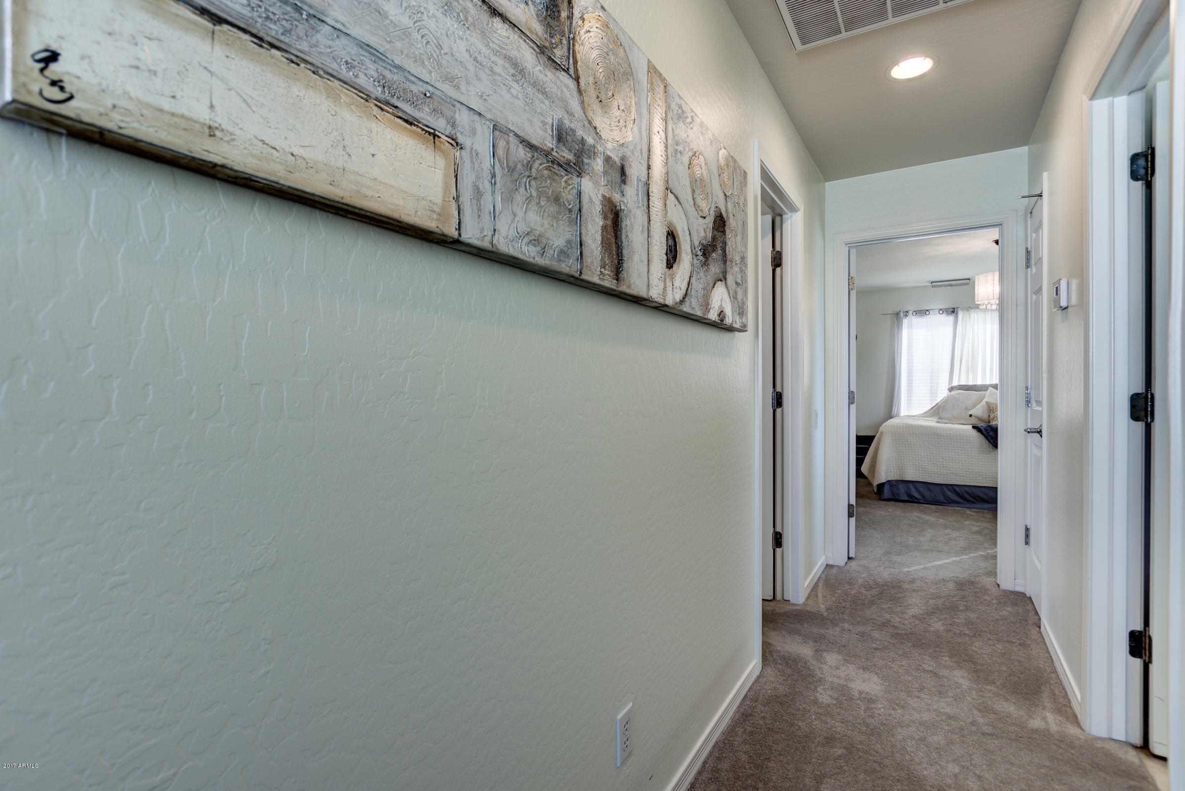 1935 West Davis Road Phoenix, AZ 85023 - Photo 19 of 30 a view of a hallway with a bedroom