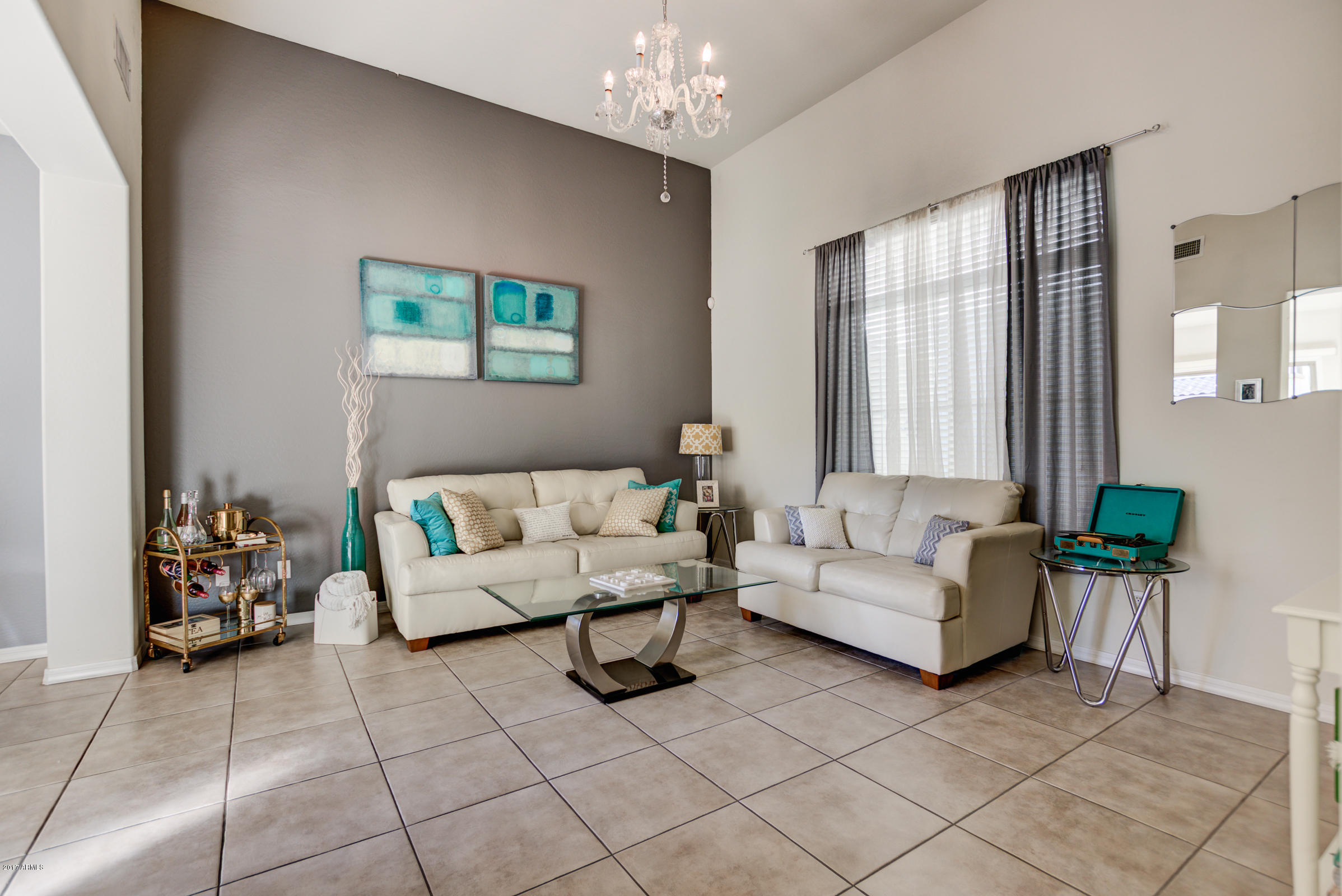 1935 West Davis Road Phoenix, AZ 85023 - Photo 5 of 30 a living room with furniture and a chandelier