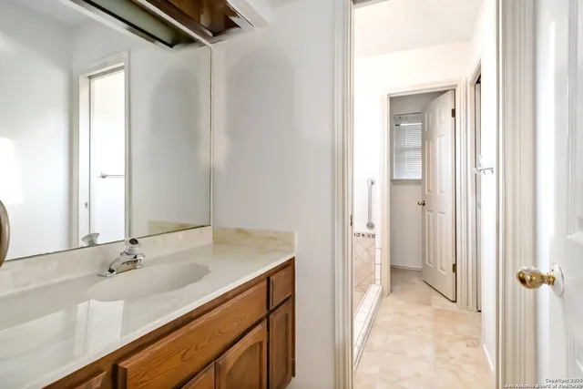 a bathroom with a sink and a mirror