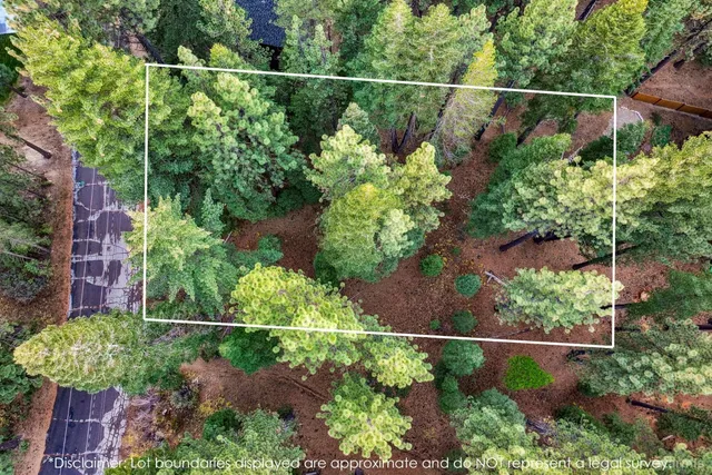 an aerial view of a house with a garden